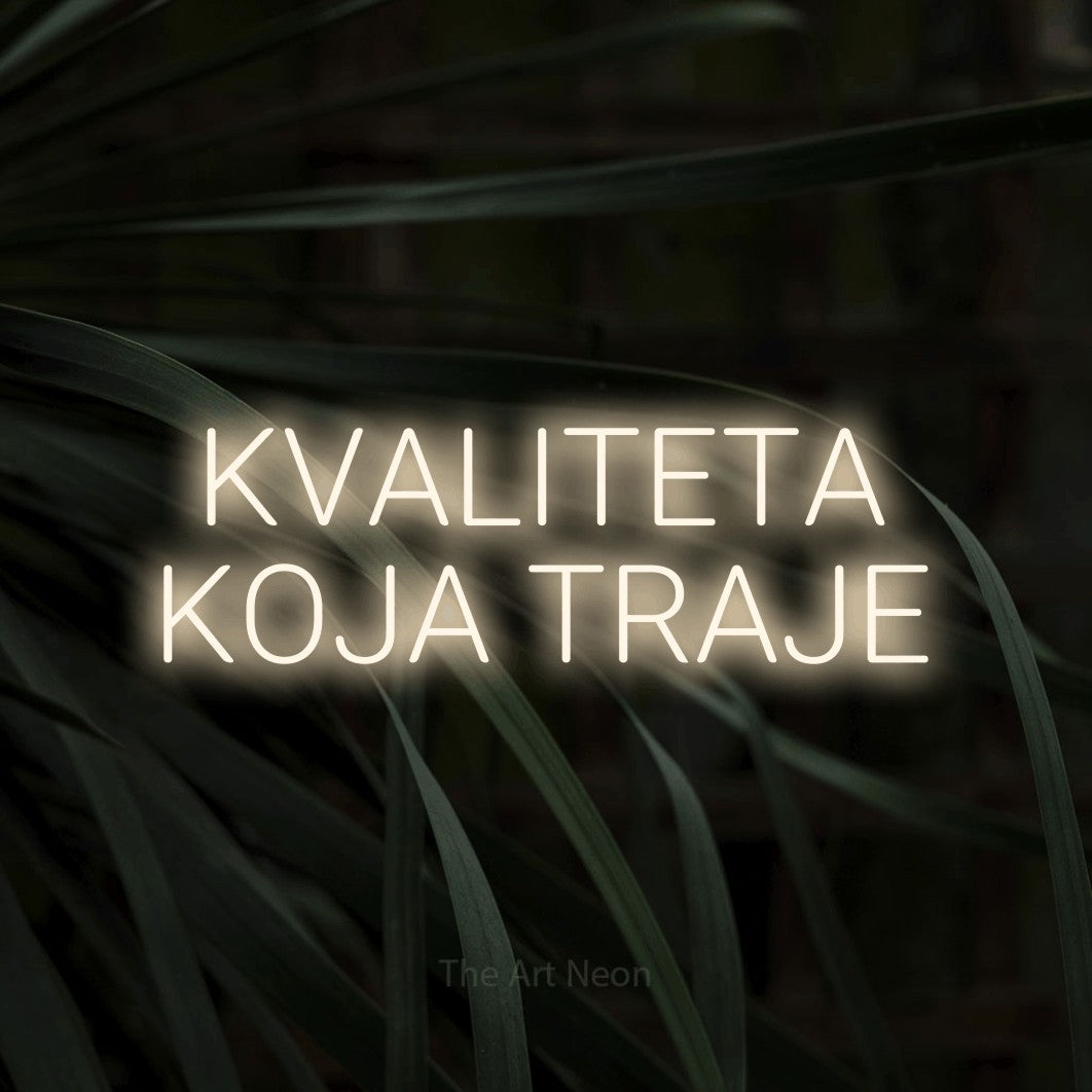 LED neon sign reading “KVALITETA KOJA TRAJE”, arranged in two lines.