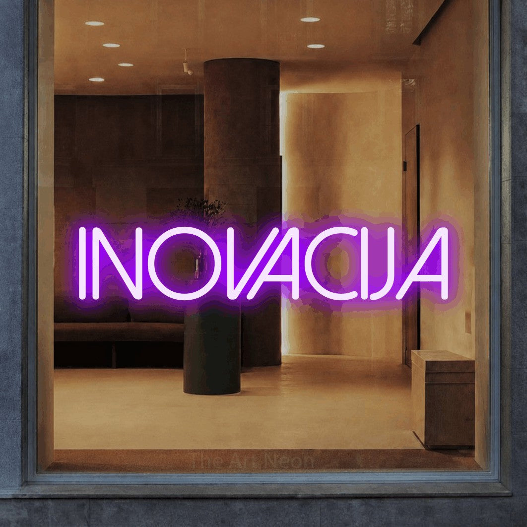 LED neon sign reading “INOVACIJA”, arranged in a single line.