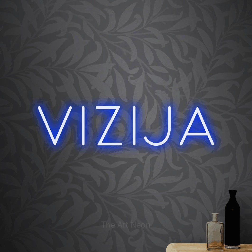 LED neon sign reading “vizija”, arranged in a single line.