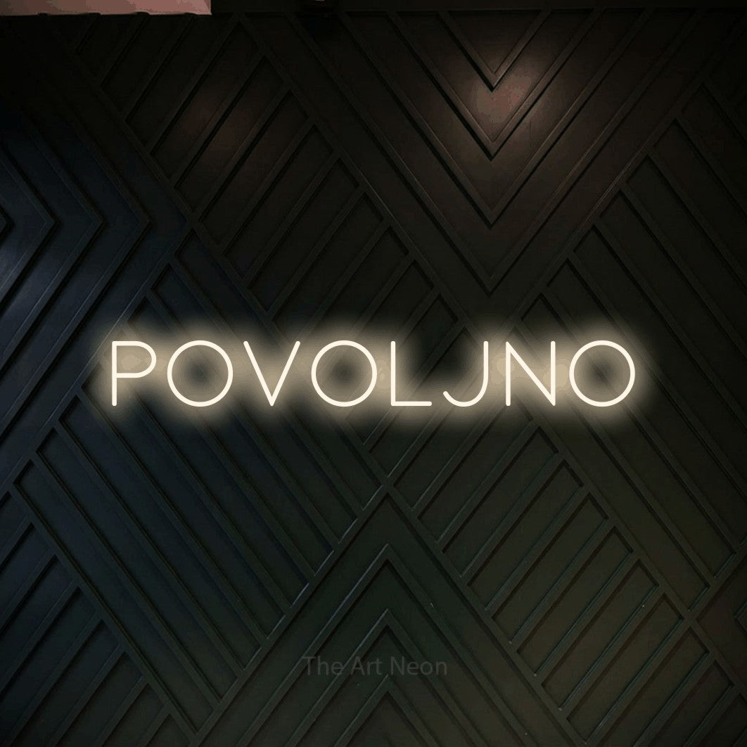 LED neon sign reading “Povoljno”, arranged in a single line.