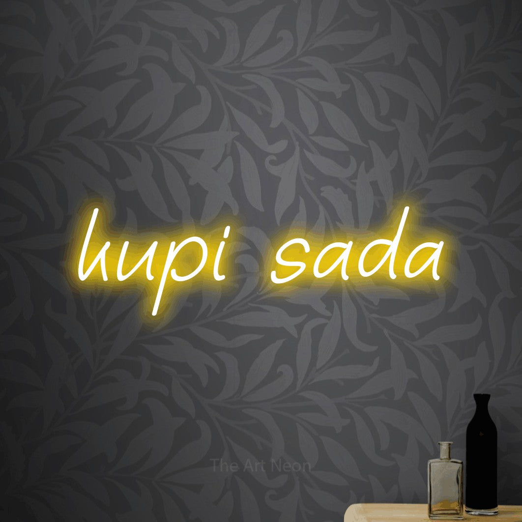 LED neon sign reading “kupi sada”, arranged in a single line.