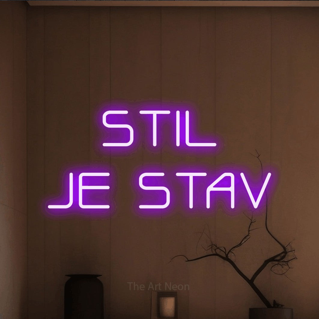 LED neon sign reading “STIL JE STAV”, arranged in two lines.