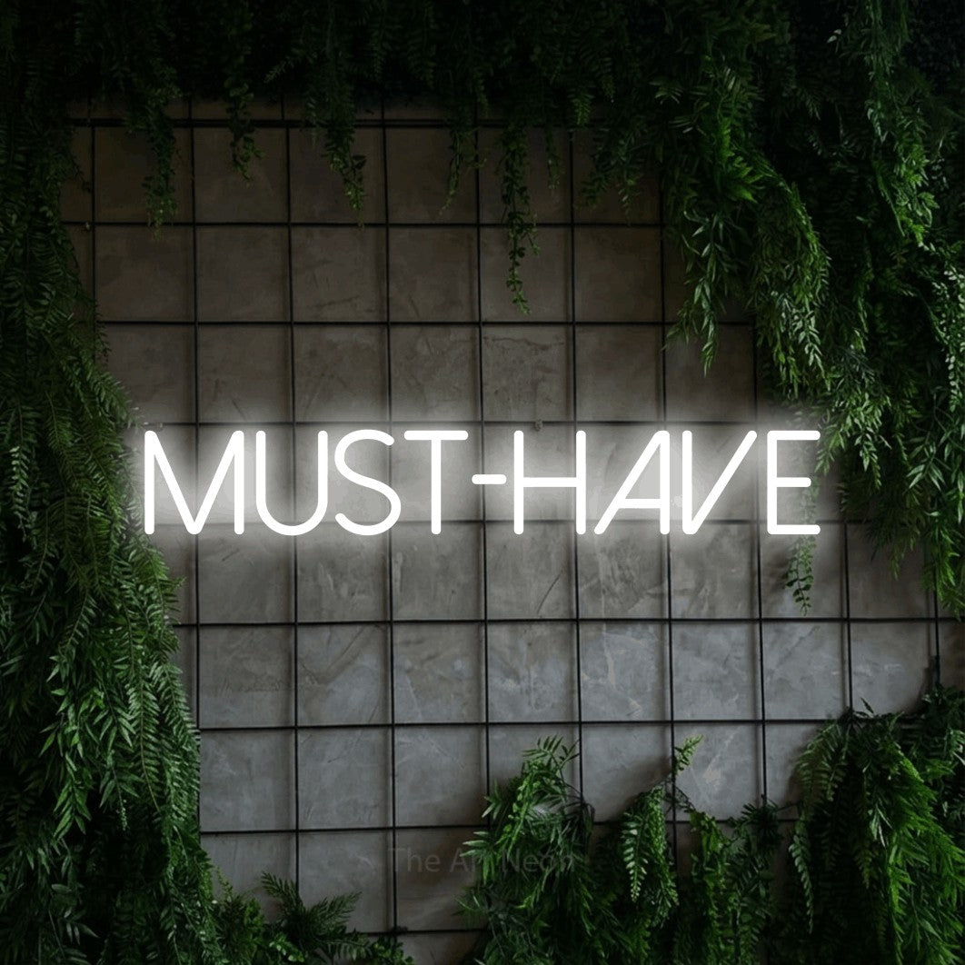 LED neon sign reading “MUST-HAVE”, arranged in a single line.