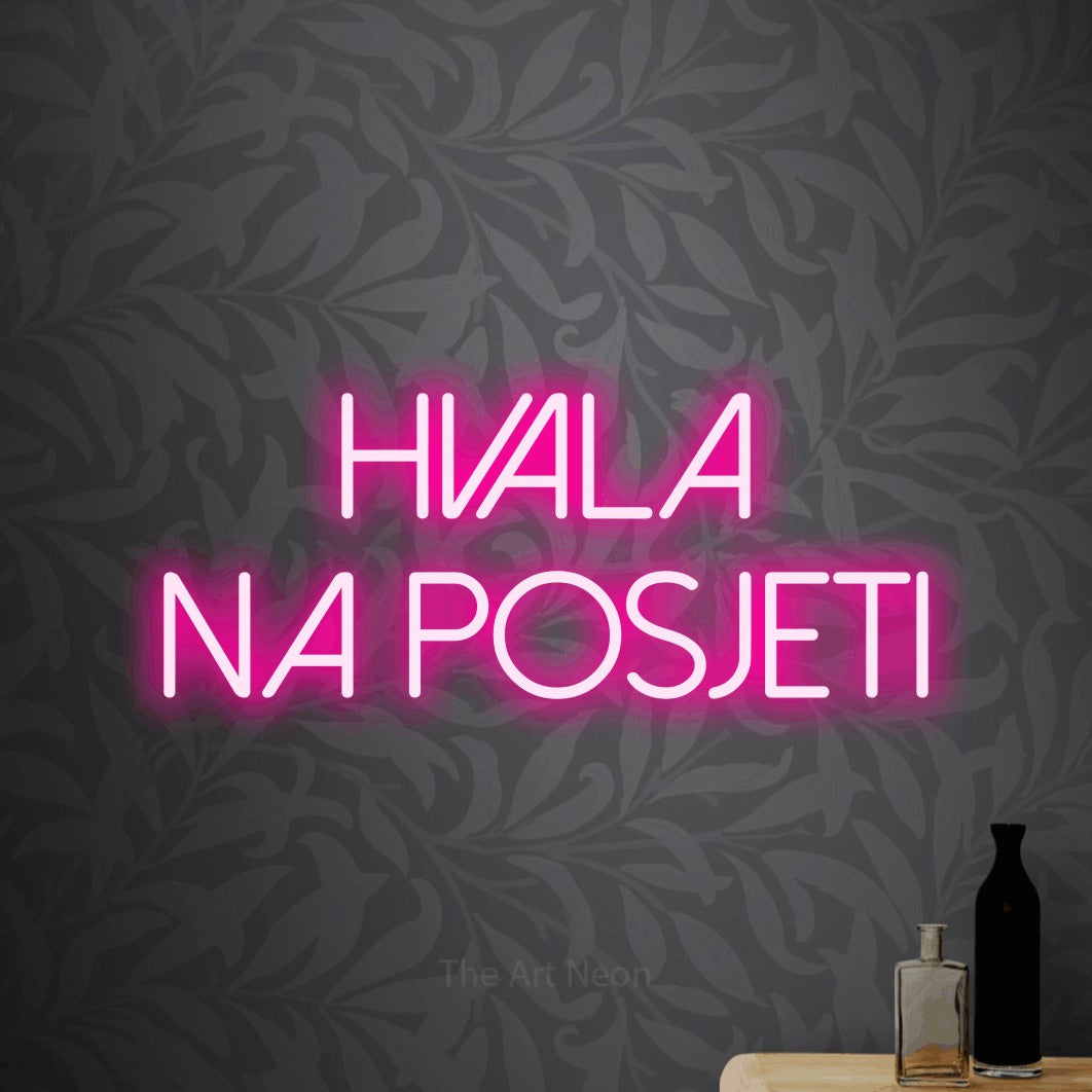 LED neon sign reading “Hvala na posjeti”, arranged in two lines.