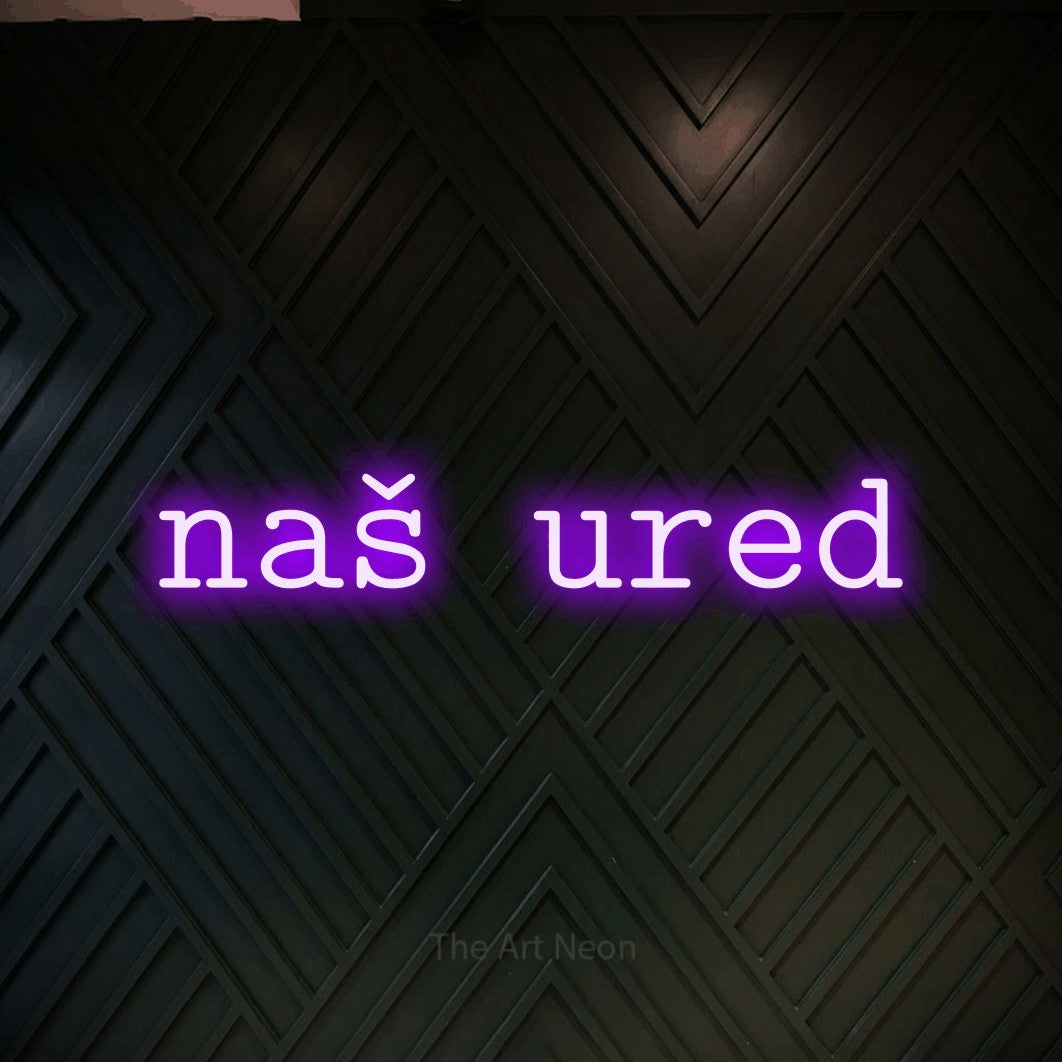 LED neon sign reading “naš ured”, arranged in a single line.