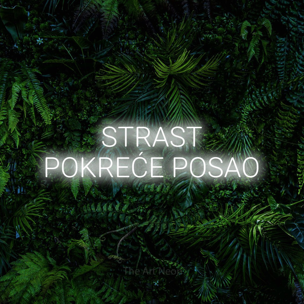 LED neon sign reading “STRAST POKREĆE POSAO”, arranged in two lines.