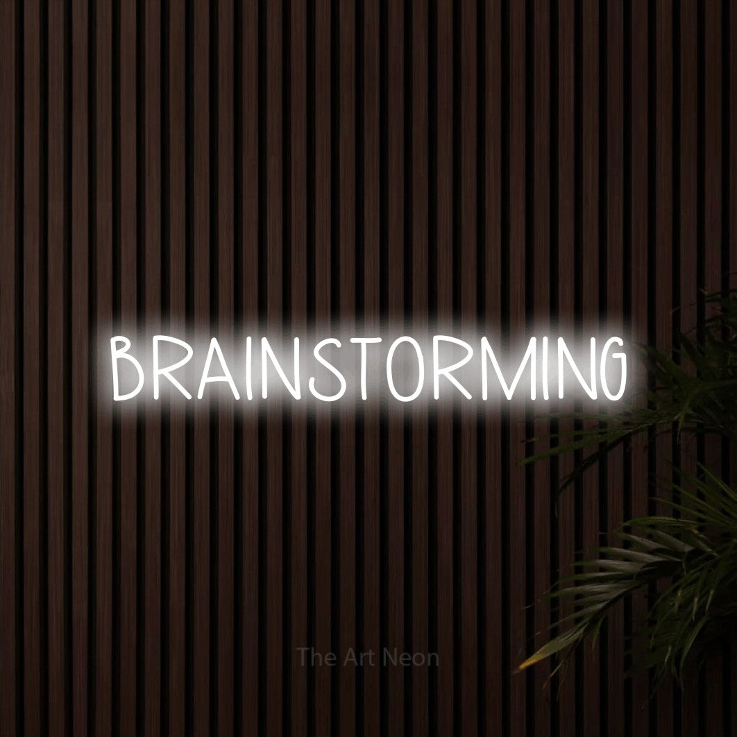 LED neon sign reading “BRAINSTORMING”, arranged in a single line.