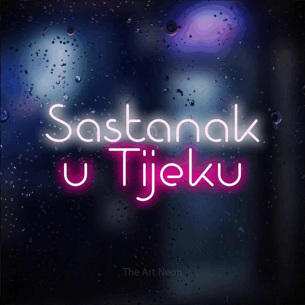 LED neon sign reading “Sastanak u Tijeku”, arranged in two lines.