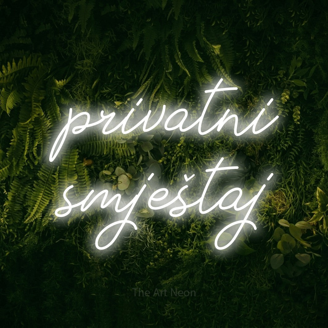 LED neon sign reading “privatni smještaj”, arranged in two lines.