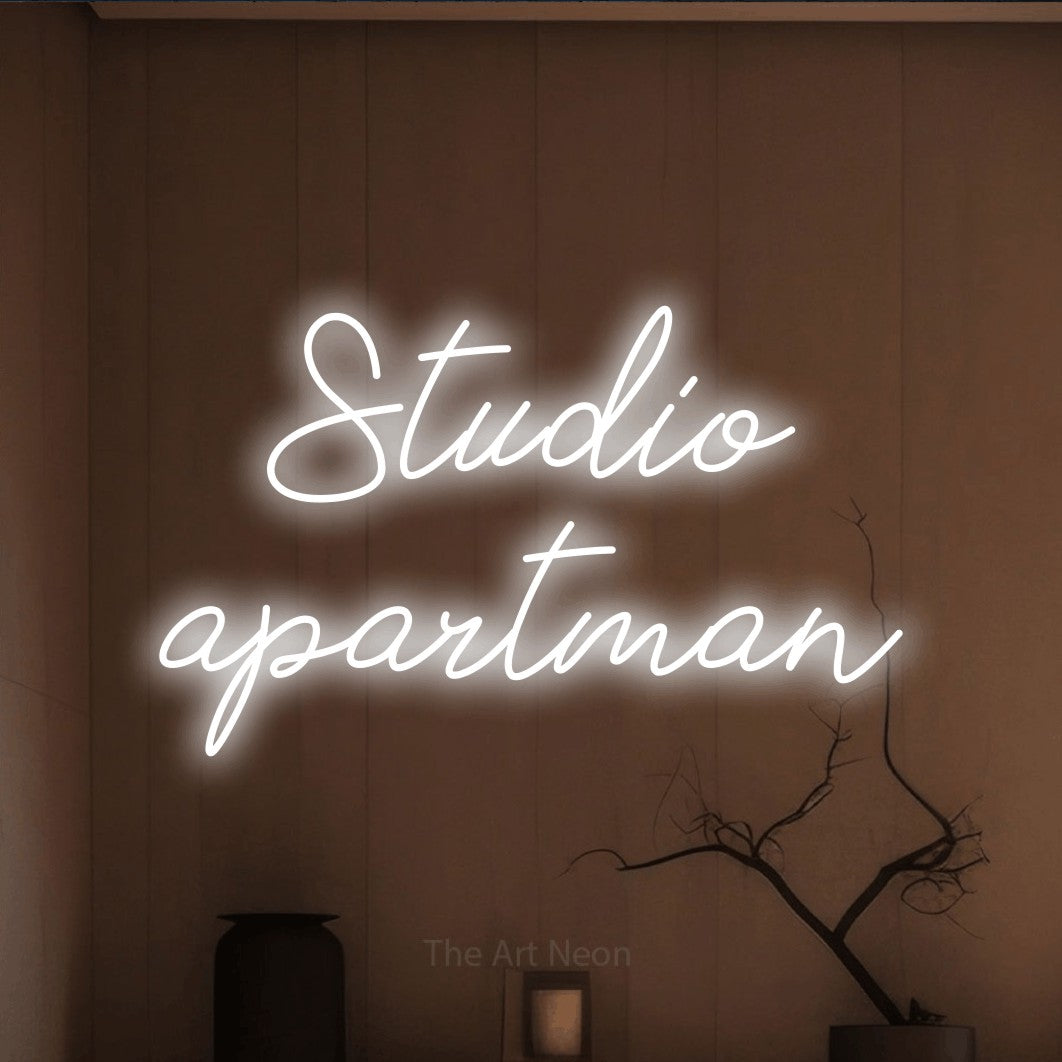 LED neon sign reading “Studio apartman”, arranged in two lines.