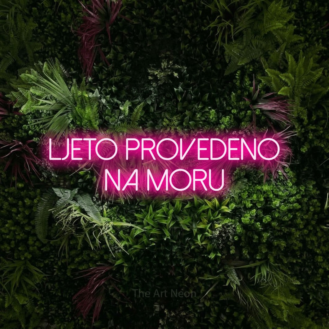 LED neon sign reading “ljeto provedeno na moru”, arranged in two lines.