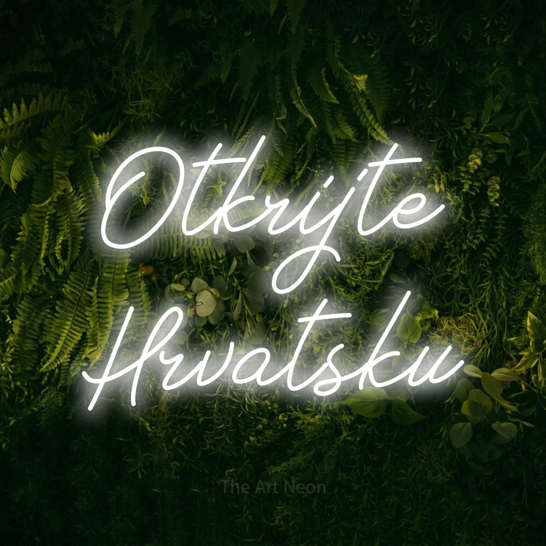 LED neon sign reading “Otkrijte Hrvatsku”, arranged in two lines.