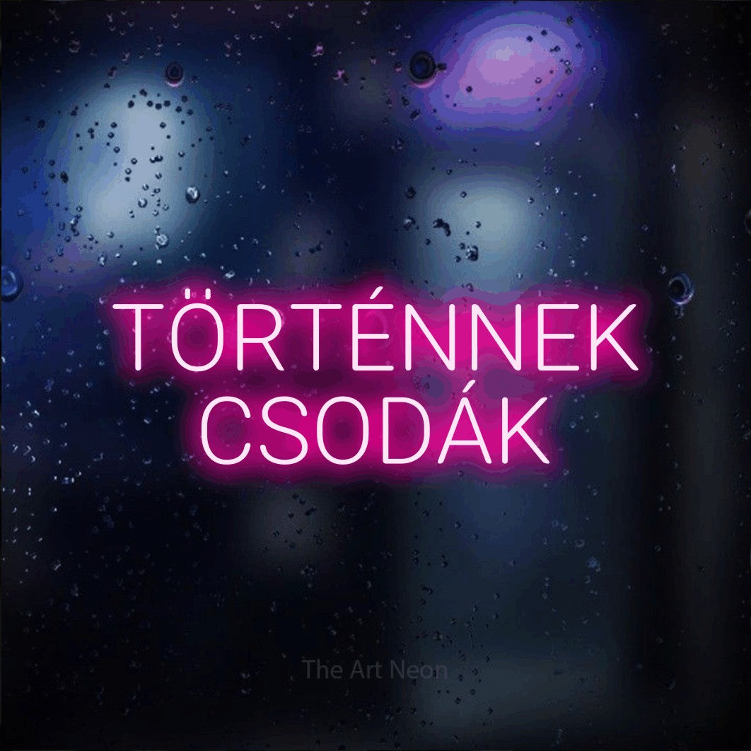 LED neon sign reading “TÖRTÉNNEK CSODÁK”, arranged in two lines.