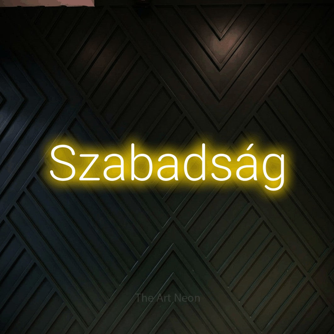 LED neon sign reading “Szabadság”, arranged in a single line.