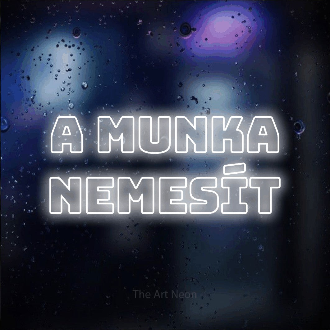 LED neon sign reading “A Munka Nemesít”, arranged in two lines.
