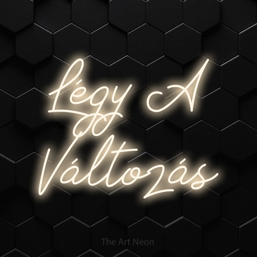LED neon sign reading “Légy A Változás”, arranged in two lines.