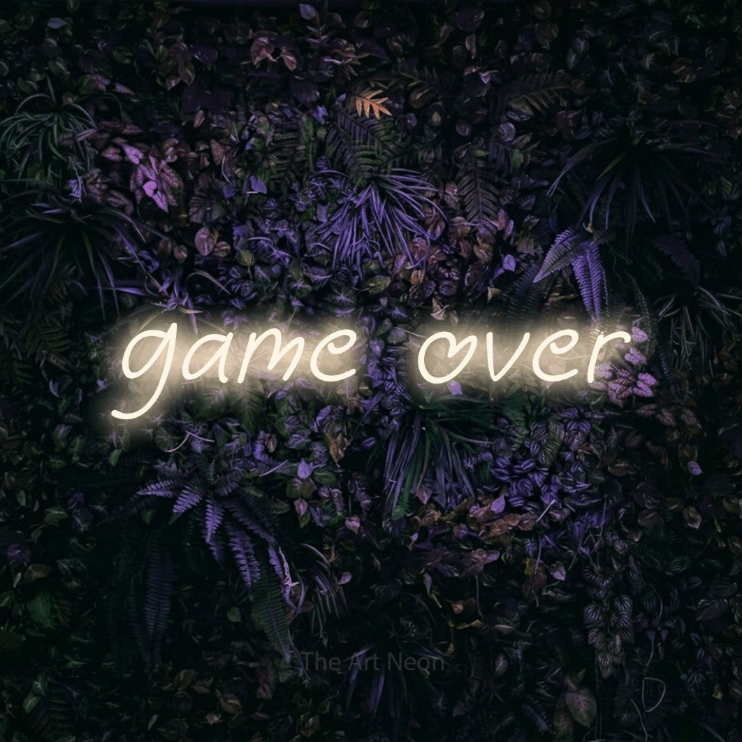 LED neon sign reading “game over”, arranged in a single line.