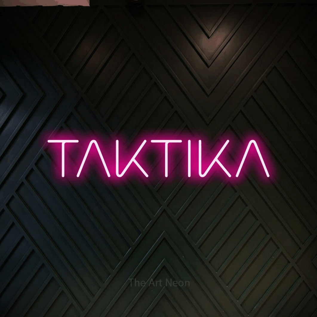 LED neon sign reading “TAKTIKA”, arranged in a single line.