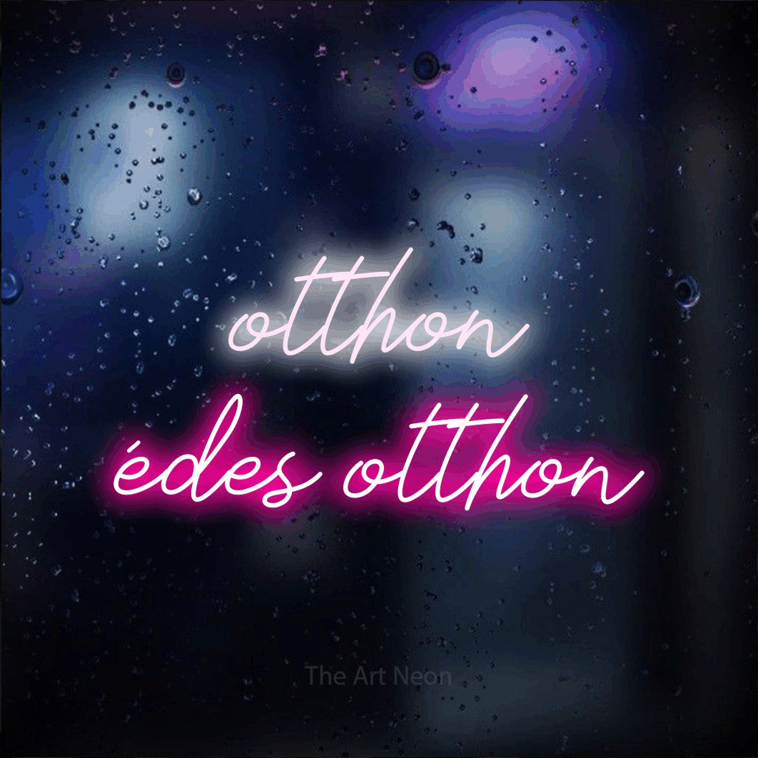 LED neon sign reading “otthon édes otthon”, arranged in two lines.
