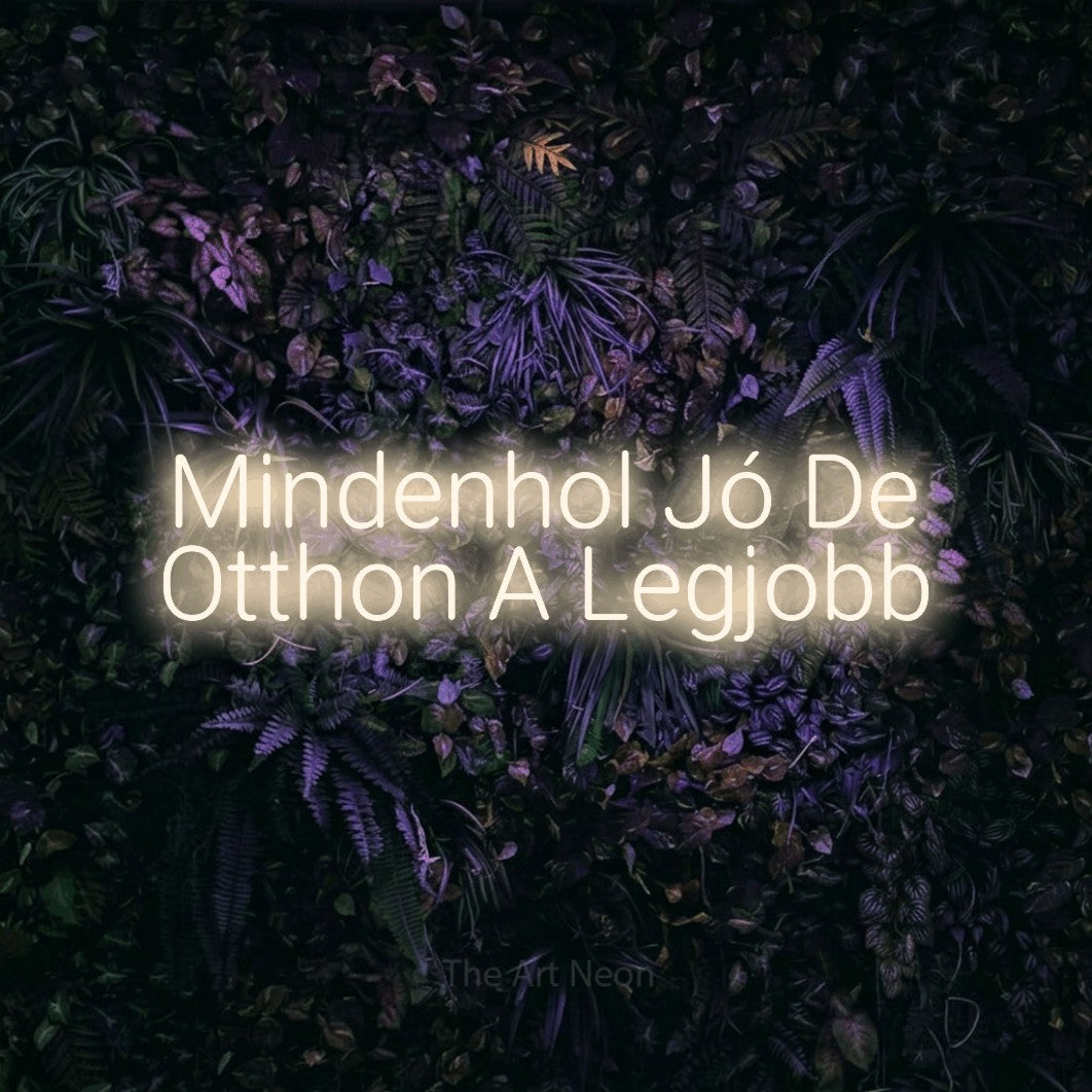 LED neon sign reading “Mindenhol Jó De Otthon A Legjobb”, arranged in two lines.