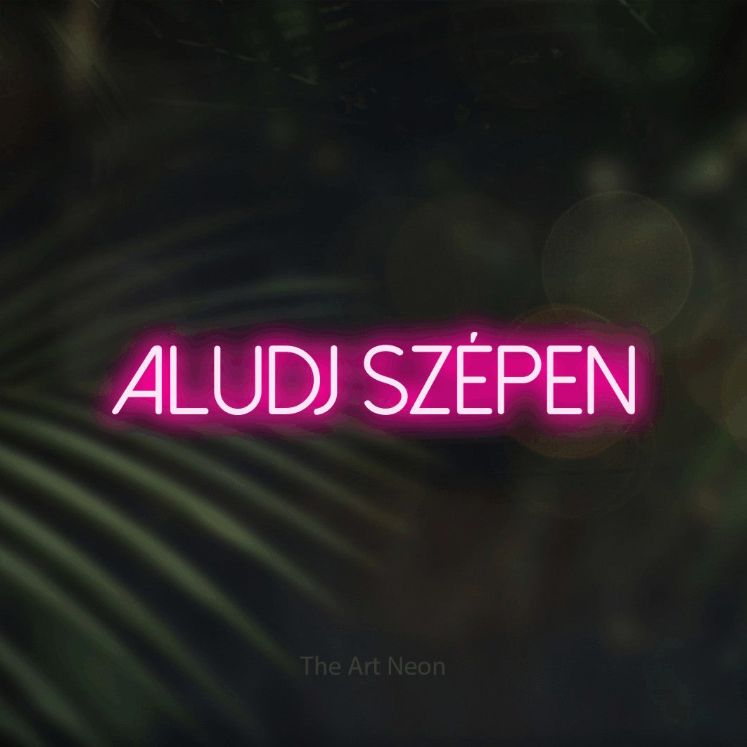 LED neon sign reading “Aludj Szépen”, arranged in a single line.