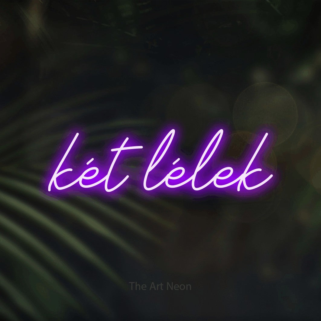 LED neon sign reading “két lélek”, arranged in a single line.