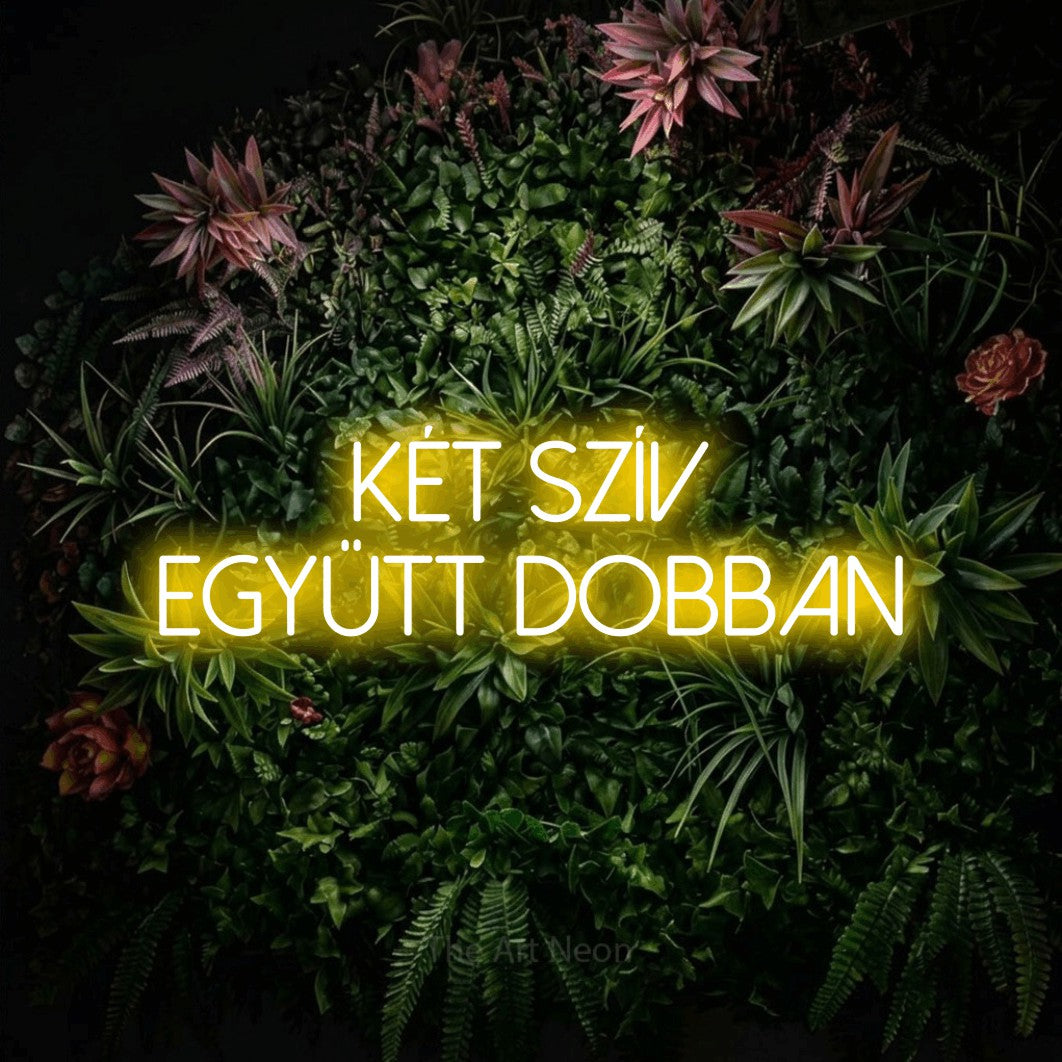 LED neon sign reading “Két Szív Együtt Dobban”, arranged in two lines.