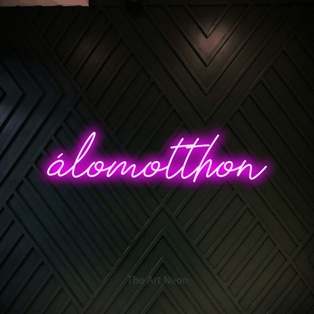 LED neon sign reading “álomotthon”, arranged in a single line.