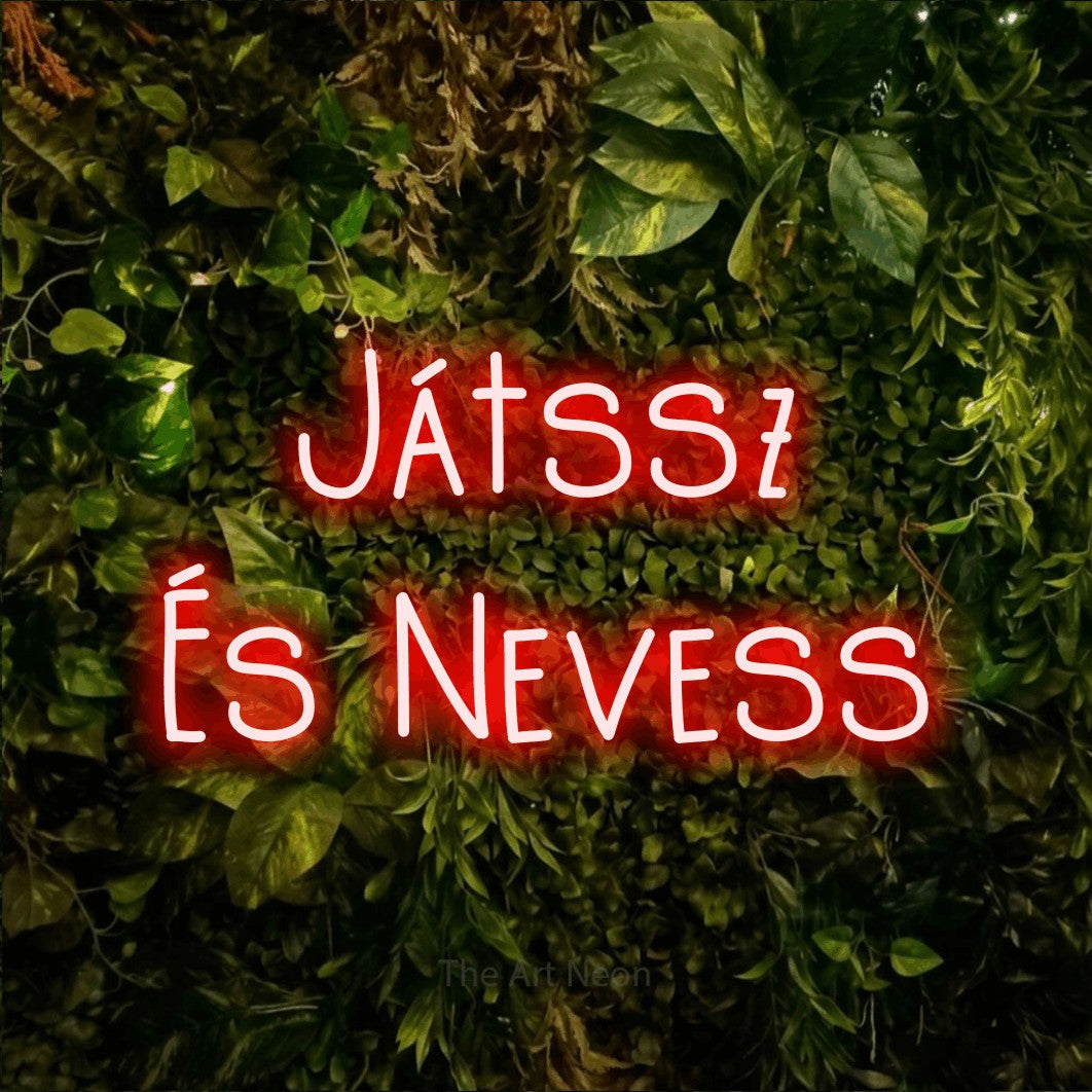 LED neon sign reading “Játssz És Nevess”, arranged in two lines.