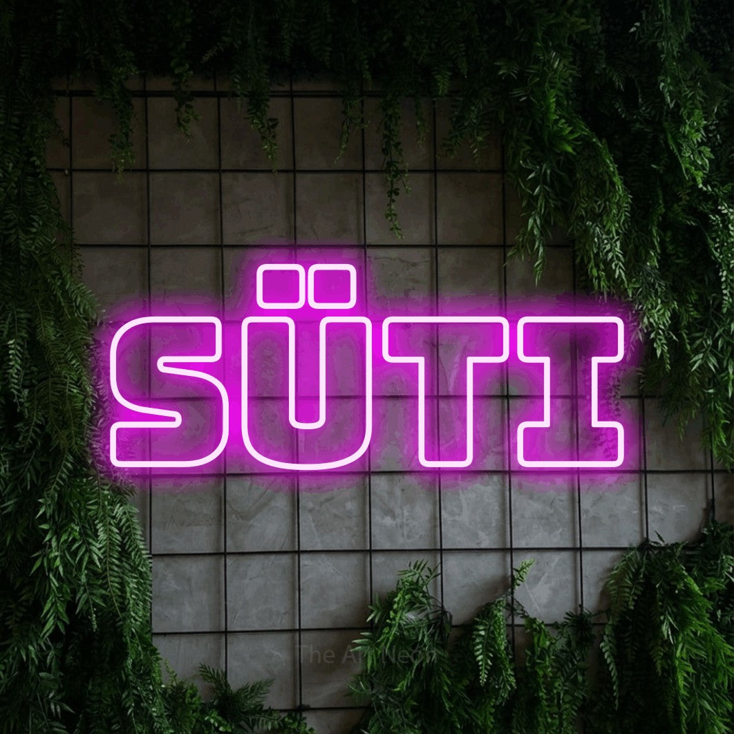 LED neon sign reading “SÜTI”, arranged in a single line.