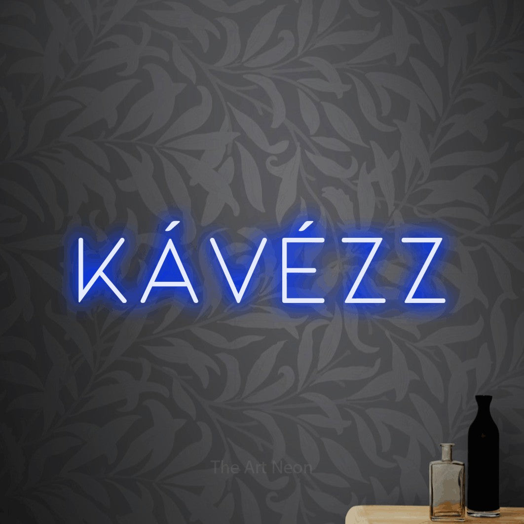 LED neon sign reading “KÁVÉZZ”, arranged in a single line.