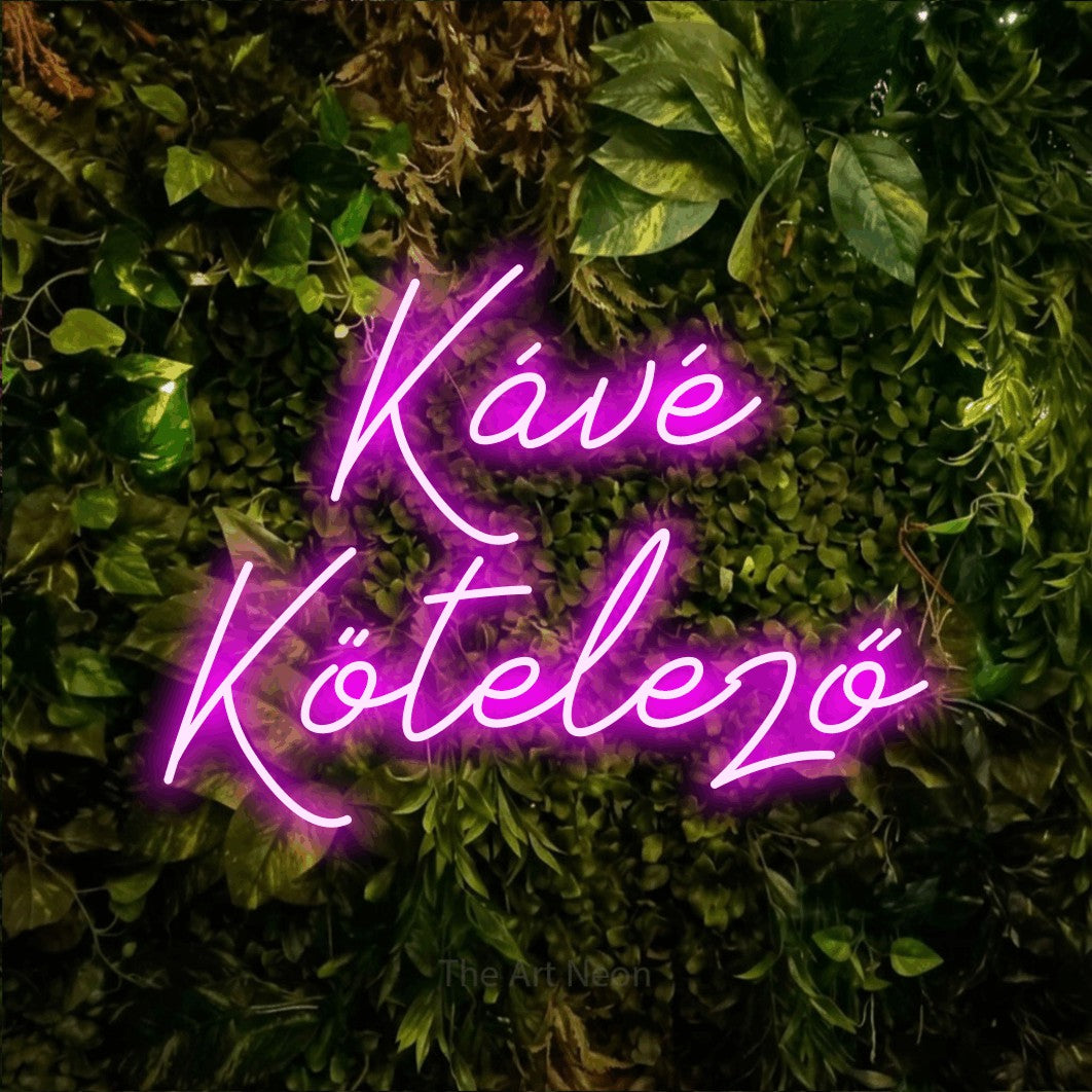 LED neon sign reading “Kávé Kötelező”, arranged in two lines.