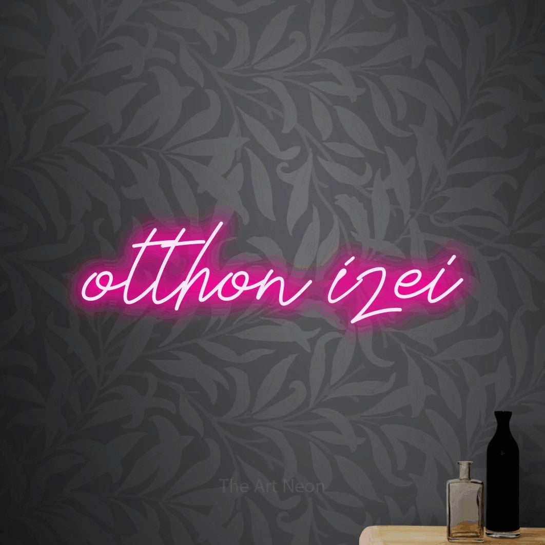 LED neon sign reading “otthon ízei”, arranged in a single line.