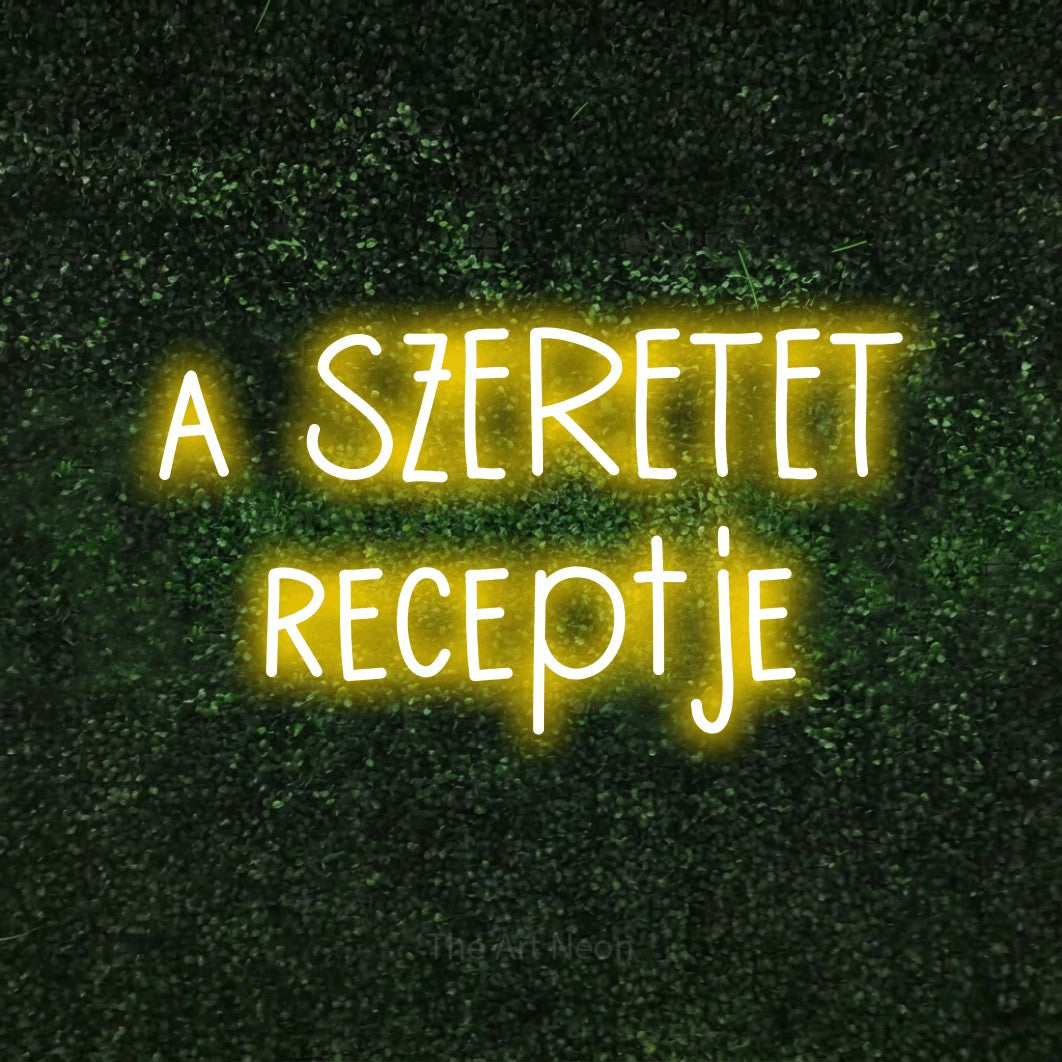 LED neon sign reading “a SZERETET receptje”, arranged in two lines.