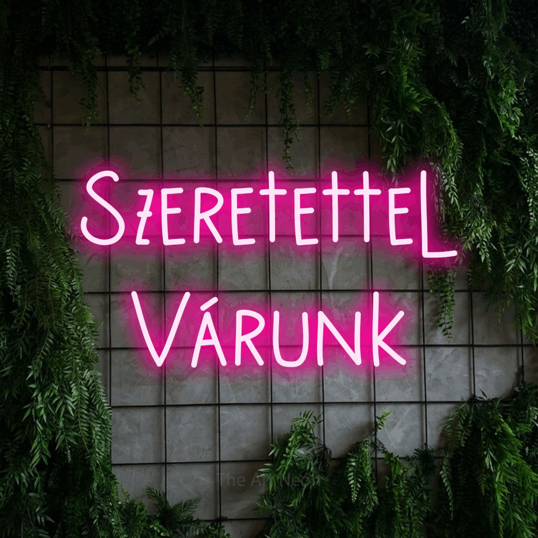 LED neon sign reading “Szeretettel Várunk”, arranged in two lines.