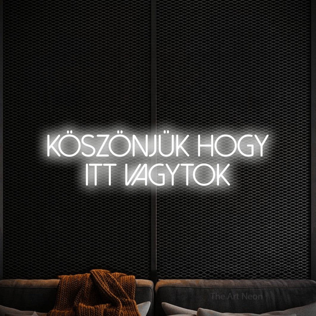 LED neon sign reading “köszönjük hogy itt vagytok”, arranged in two lines.
