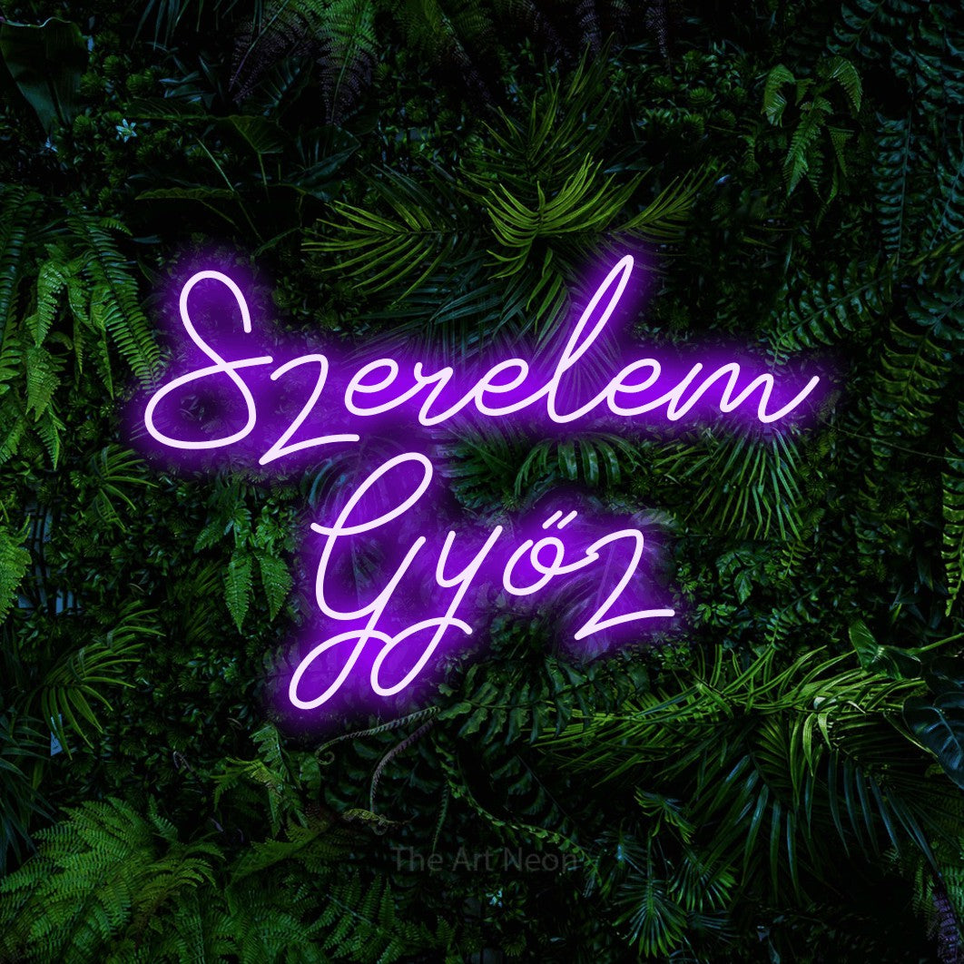 LED neon sign reading “Szerelem Győz”, arranged in two lines.