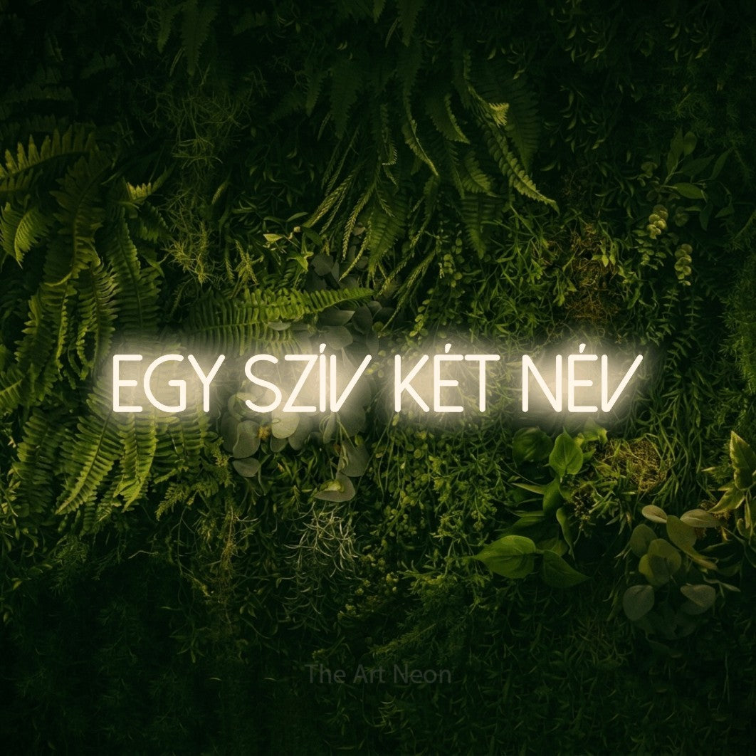 LED neon sign reading “Egy Szív Két Név”, arranged in a single line.
