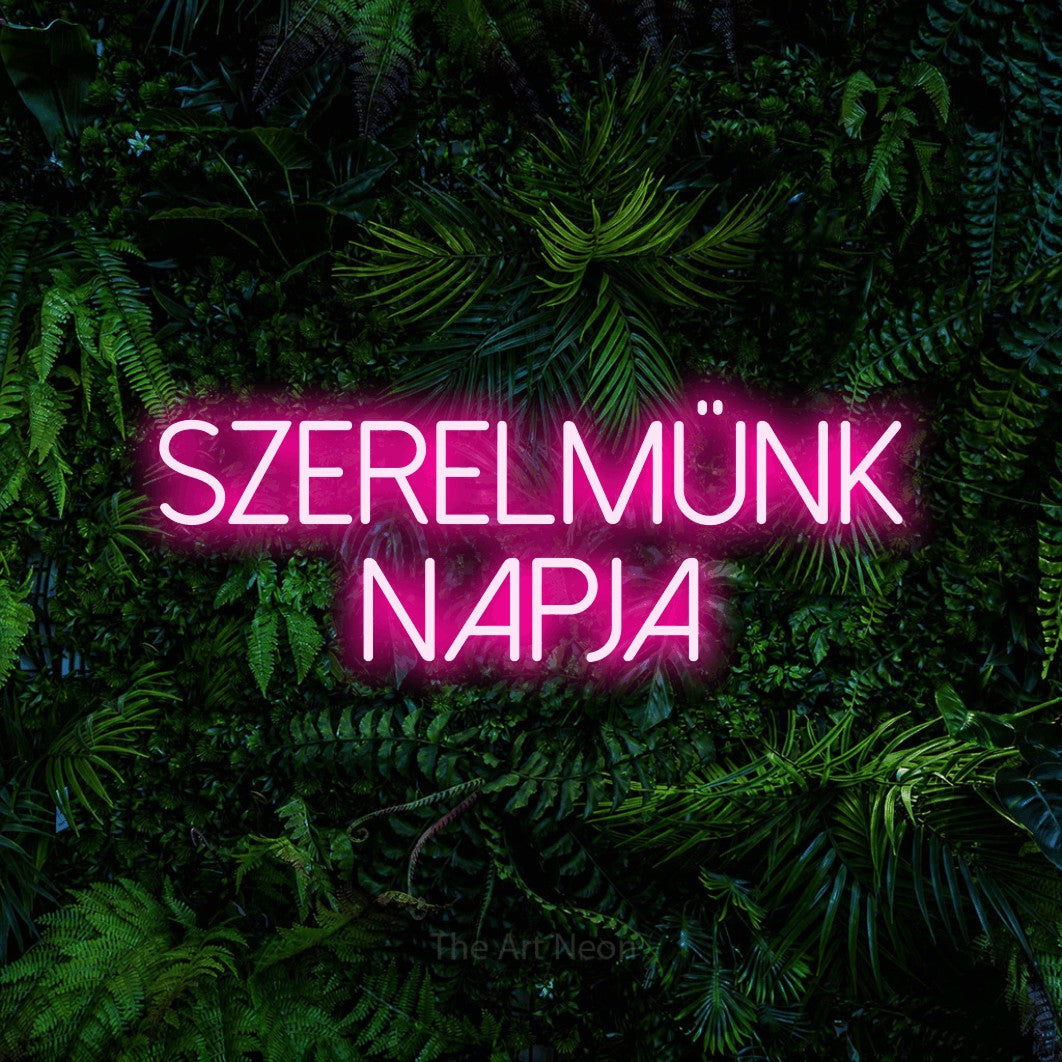 LED neon sign reading “SZERELMÜNK NAPJA”, arranged in two lines.