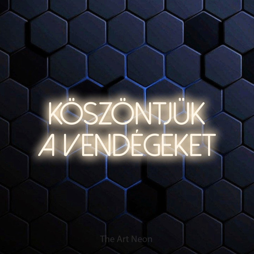 LED neon sign reading “Köszöntjük A Vendégeket”, arranged in two lines.