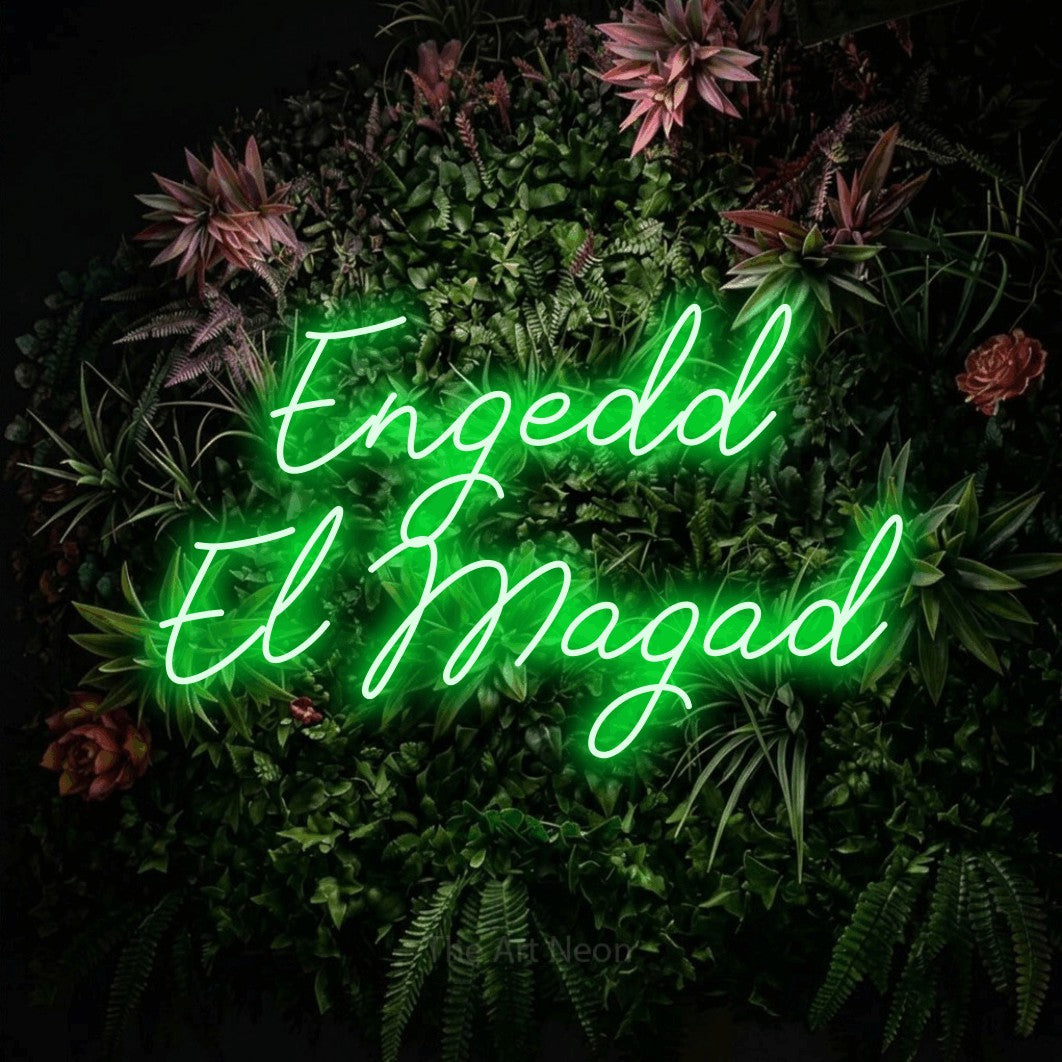 LED neon sign reading “Engedd El Magad”, arranged in two lines.
