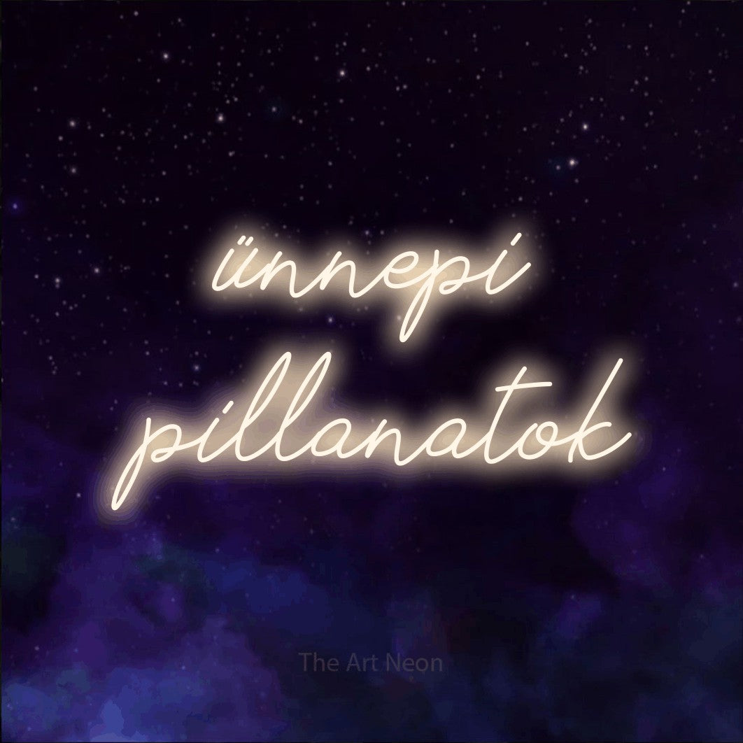 LED neon sign reading “ünnepi pillanatok”, arranged in two lines.