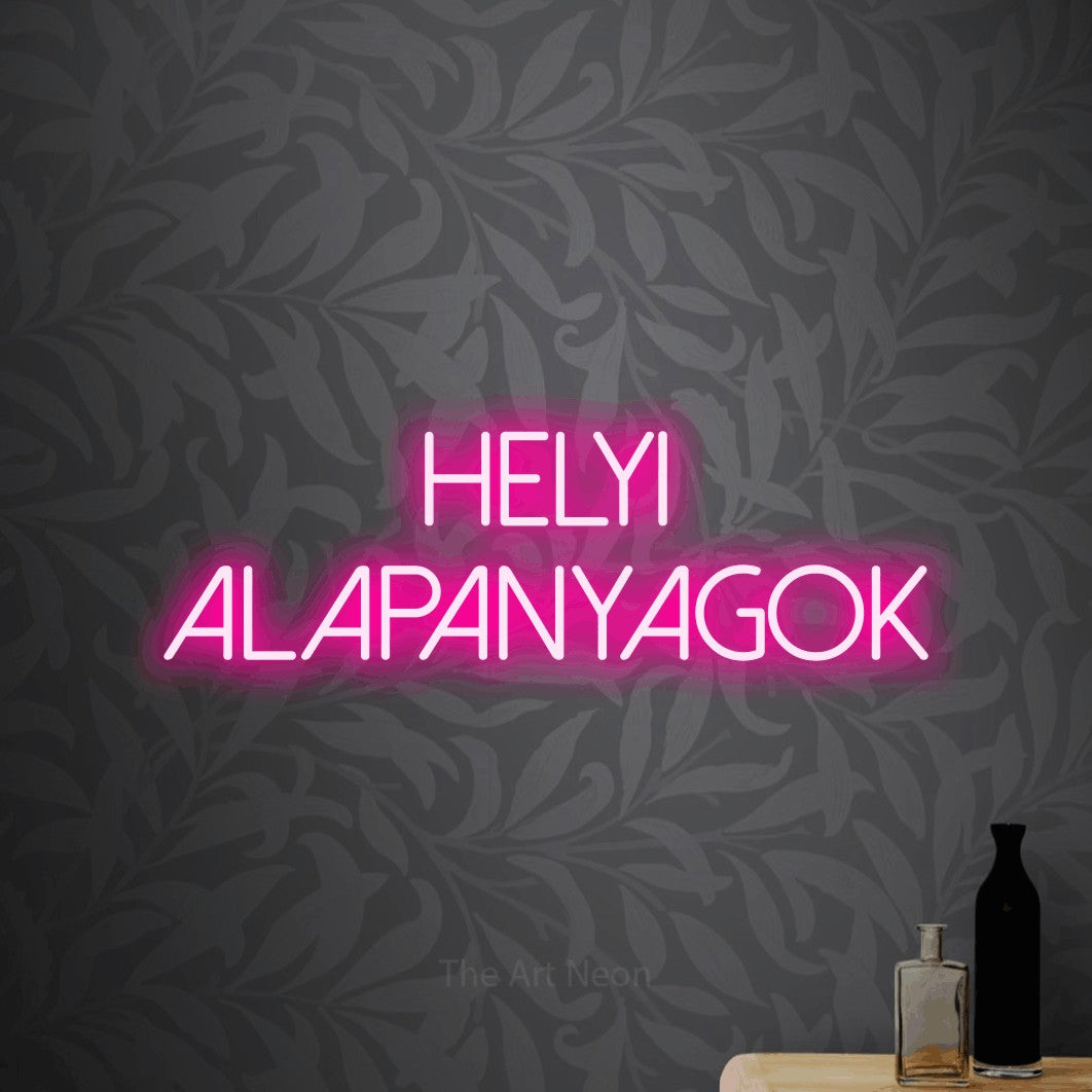 LED neon sign reading “HELYI ALAPANYAGOK”, arranged in two lines.