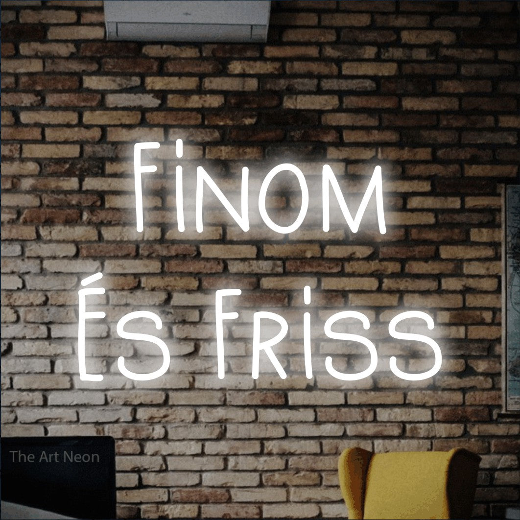 LED neon sign reading “Finom És Friss”, arranged in two lines.