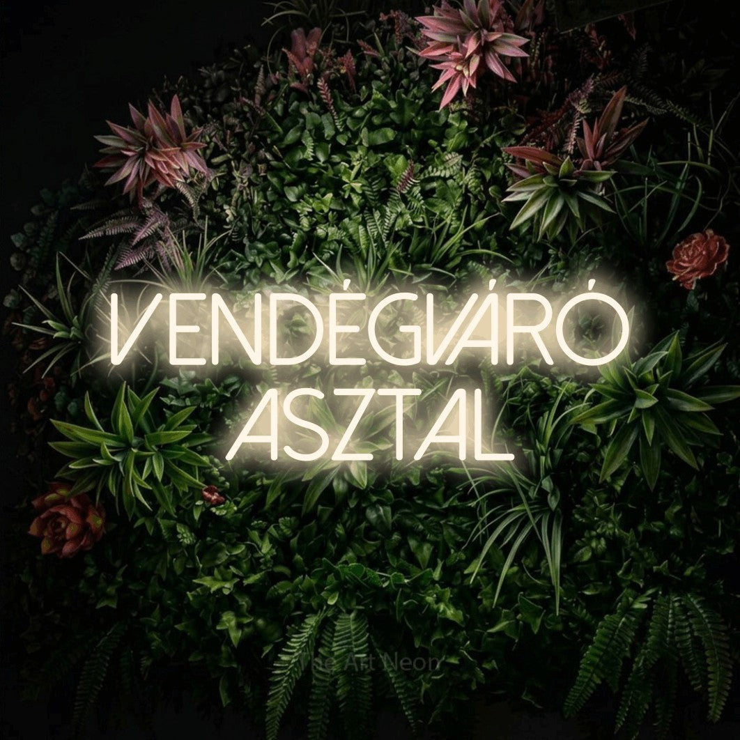 LED neon sign reading “vendégváró asztal”, arranged in two lines.