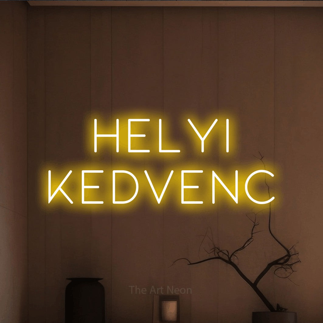 LED neon sign reading “HELYI KEDVENC”, arranged in two lines.