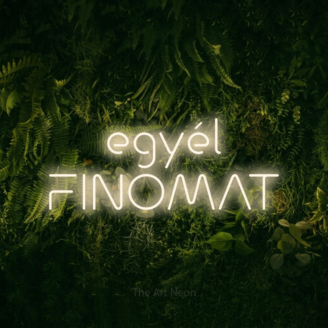 LED neon sign reading “egyél FINOMAT”, arranged in two lines.
