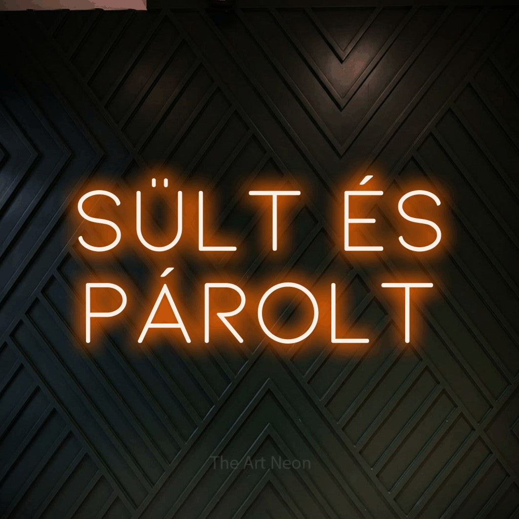 LED neon sign reading “SÜLT ÉS PÁROLT”, arranged in two lines.