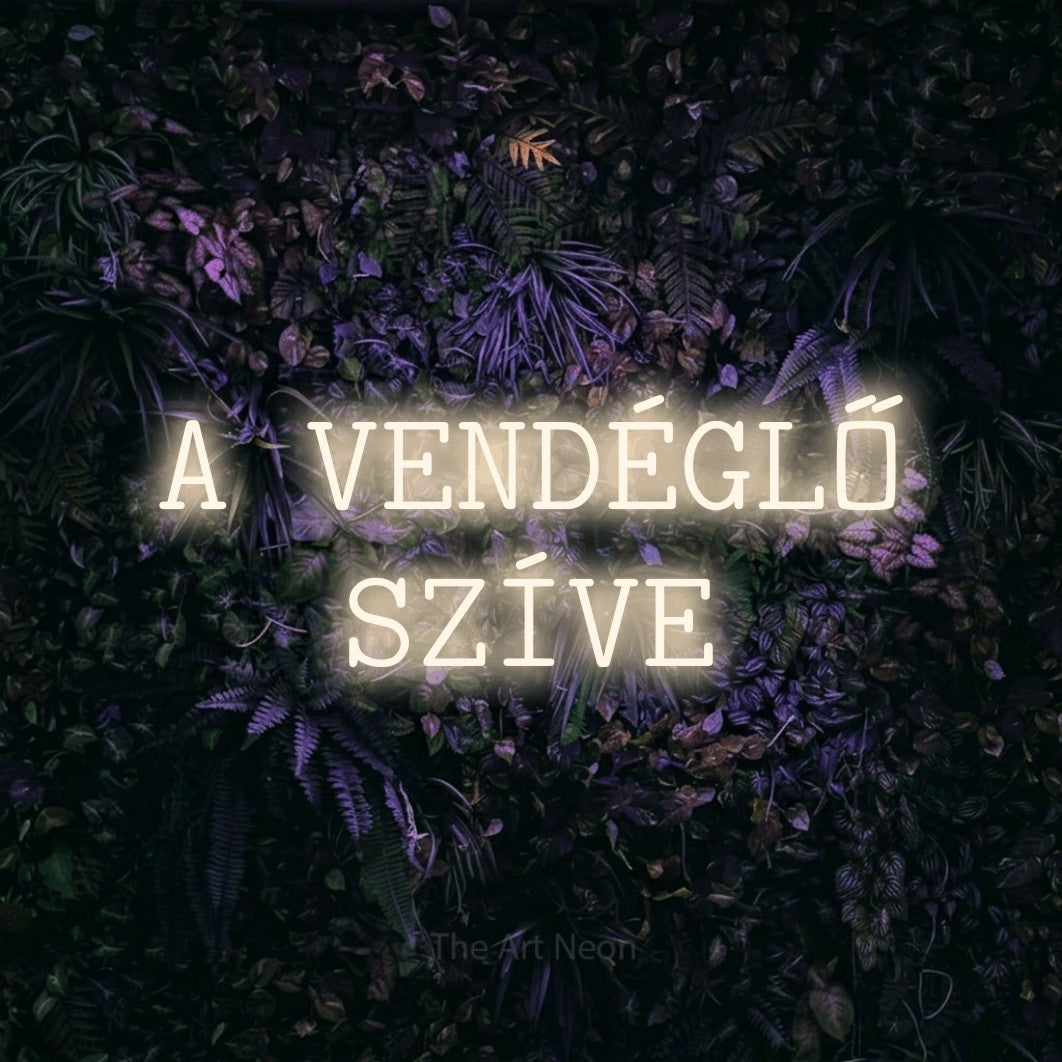 LED neon sign reading “A VENDÉGLŐ SZÍVE”, arranged in two lines.