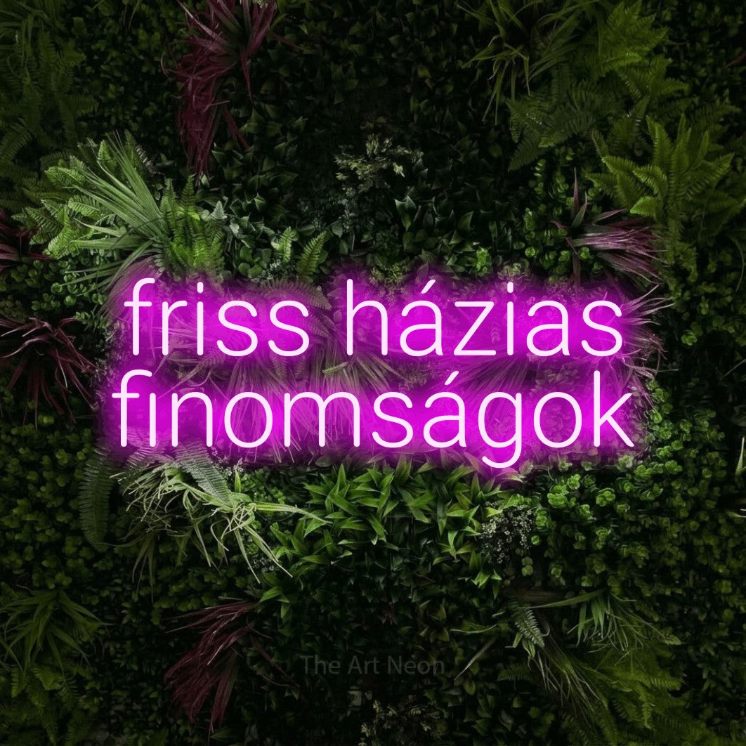 LED neon sign reading “friss házias finomságok”, arranged in two lines.